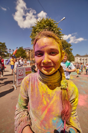 KALININGRAD, RUSSIA - JUNE 12, 2015: People with painted faces during the Holi Festival of Colors. Holi is a festival celebrated as a festival of coloursのeditorial素材
