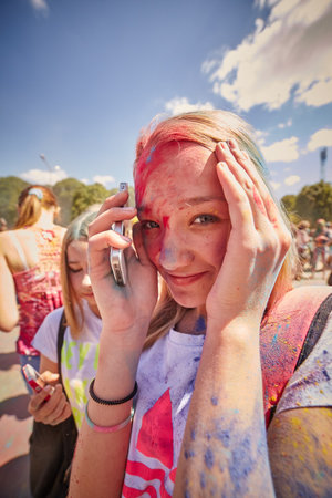 KALININGRAD, RUSSIA - JUNE 12, 2015: People with painted faces during the Holi Festival of Colors. Holi is a festival celebrated as a festival of coloursのeditorial素材