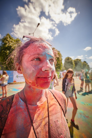 KALININGRAD, RUSSIA - JUNE 12, 2015: People with painted faces during the Holi Festival of Colors. Holi is a festival celebrated as a festival of coloursのeditorial素材
