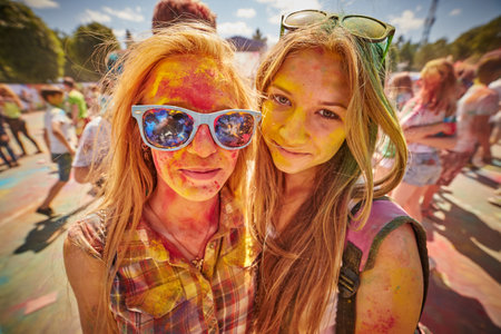 KALININGRAD, RUSSIA - JUNE 12, 2015: People with painted faces during the Holi Festival of Colors. Holi is a festival celebrated as a festival of coloursのeditorial素材