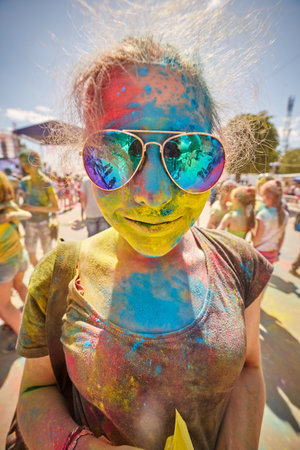 KALININGRAD, RUSSIA - JUNE 12, 2015: People with painted faces during the Holi Festival of Colors. Holi is a festival celebrated as a festival of coloursのeditorial素材