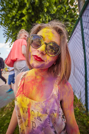 KALININGRAD, RUSSIA - JUNE 12, 2015: People with painted faces during the Holi Festival of Colors. Holi is a festival celebrated as a festival of coloursのeditorial素材