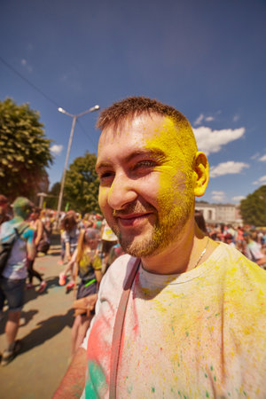 KALININGRAD, RUSSIA - JUNE 12, 2015: People with painted faces during the Holi Festival of Colors. Holi is a festival celebrated as a festival of coloursのeditorial素材