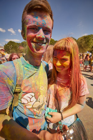 KALININGRAD, RUSSIA - JUNE 12, 2015: People with painted faces during the Holi Festival of Colors. Holi is a festival celebrated as a festival of coloursのeditorial素材