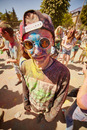 KALININGRAD, RUSSIA - JUNE 12, 2015: People with painted faces during the Holi Festival of Colors. Holi is a festival celebrated as a festival of coloursのeditorial素材