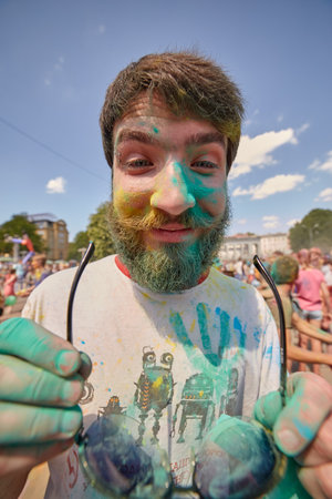 KALININGRAD, RUSSIA - JUNE 12, 2015: People with painted faces during the Holi Festival of Colors. Holi is a festival celebrated as a festival of coloursのeditorial素材