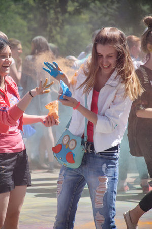 KALININGRAD, RUSSIA - JUNE 06, 2015: People with multicolor paint dust during the Holi Festival of Colors. Holi is a festival celebrated as a festival of coloursのeditorial素材
