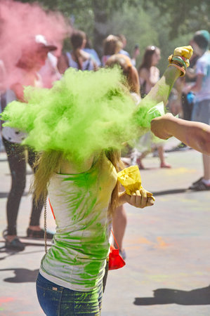 KALININGRAD, RUSSIA - JUNE 06, 2015: People with multicolor paint dust during the Holi Festival of Colors. Holi is a festival celebrated as a festival of coloursのeditorial素材
