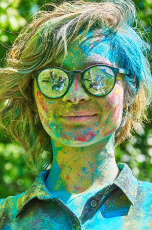 KALININGRAD, RUSSIA - JUNE 06, 2015: People with multicolored face during the Holi Festival of Colors. Holi is a festival celebrated as a festival of coloursのeditorial素材
