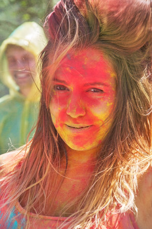 KALININGRAD, RUSSIA - JUNE 06, 2015: People with multicolored face during the Holi Festival of Colors. Holi is a festival celebrated as a festival of coloursのeditorial素材