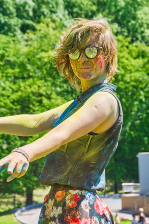 KALININGRAD, RUSSIA - JUNE 06, 2015: People with multicolored face during the Holi Festival of Colors. Holi is a festival celebrated as a festival of coloursのeditorial素材