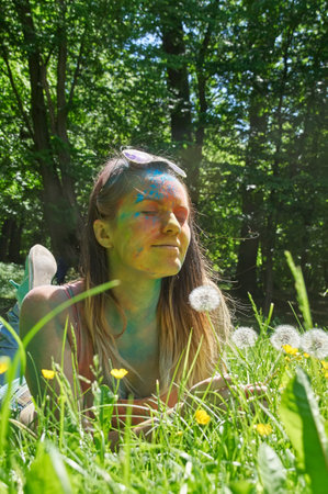 KALININGRAD, RUSSIA - JUNE 06, 2015: People with multicolored face during the Holi Festival of Colors. Holi is a festival celebrated as a festival of coloursのeditorial素材