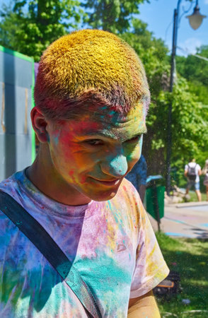 KALININGRAD, RUSSIA - JUNE 06, 2015: People with multicolor paint dust during the Holi Festival of Colors. Holi is a festival celebrated as a festival of coloursのeditorial素材