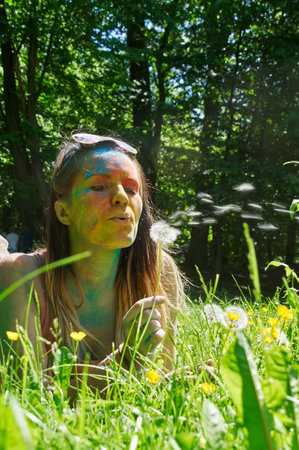 KALININGRAD, RUSSIA - JUNE 06, 2015: People with multicolored face during the Holi Festival of Colors. Holi is a festival celebrated as a festival of coloursのeditorial素材