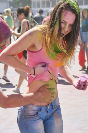 KALININGRAD, RUSSIA - JUNE 06, 2015: People with multicolor paint dust during the Holi Festival of Colors. Holi is a festival celebrated as a festival of coloursのeditorial素材