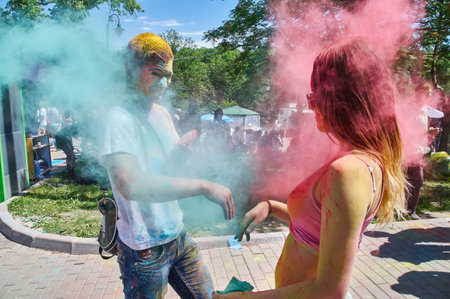 KALININGRAD, RUSSIA - JUNE 06, 2015: People with multicolor paint dust during the Holi Festival of Colors. Holi is a festival celebrated as a festival of coloursのeditorial素材