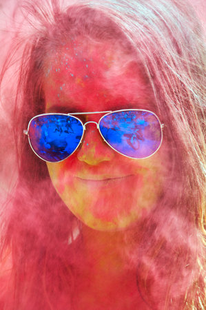KALININGRAD, RUSSIA - JUNE 06, 2015: People with multicolored face during the Holi Festival of Colors. Holi is a festival celebrated as a festival of coloursのeditorial素材