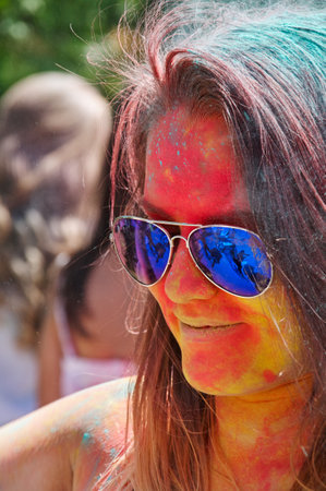 KALININGRAD, RUSSIA - JUNE 06, 2015: People with multicolored face during the Holi Festival of Colors. Holi is a festival celebrated as a festival of coloursのeditorial素材