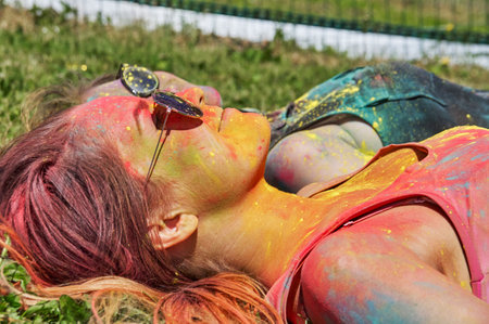KALININGRAD, RUSSIA - JUNE 06, 2015: People with multicolored face during the Holi Festival of Colors. Holi is a festival celebrated as a festival of coloursのeditorial素材