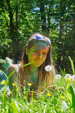 KALININGRAD, RUSSIA - JUNE 06, 2015: People with multicolored face during the Holi Festival of Colors. Holi is a festival celebrated as a festival of coloursのeditorial素材