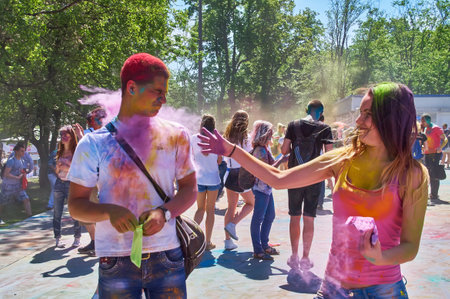 KALININGRAD, RUSSIA - JUNE 06, 2015: People with multicolor paint dust during the Holi Festival of Colors. Holi is a festival celebrated as a festival of coloursのeditorial素材