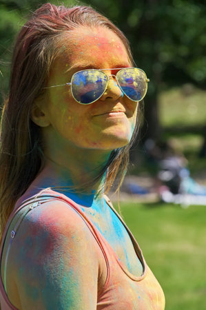 KALININGRAD, RUSSIA - JUNE 06, 2015: People with multicolored face during the Holi Festival of Colors. Holi is a festival celebrated as a festival of coloursのeditorial素材