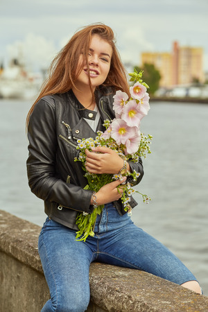happy woman with flowers bouquetの写真素材