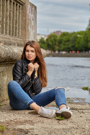 pretty woman in leather jacket portraitの写真素材