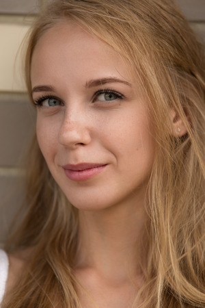 happy smiling blond girl portraitの写真素材