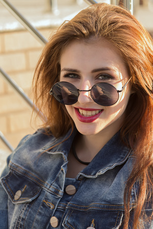 happy woman with long red hair portraitの写真素材