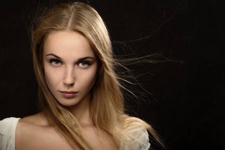 luxury blond girl on black backgroundの写真素材
