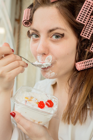 happy girl eating cherry dessertの写真素材