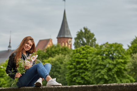 happy woman with flowers bouquetの写真素材