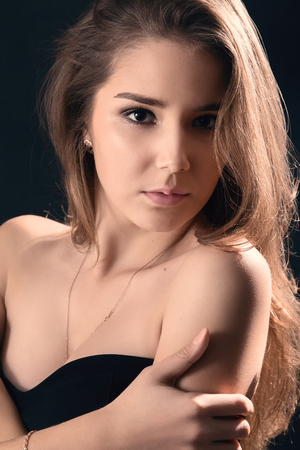 serious woman portrait with naked shouldersの写真素材