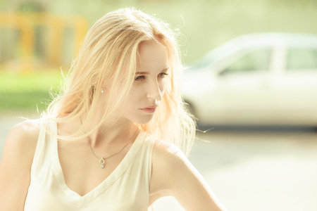 beautiful blond woman in sunlight, toned image