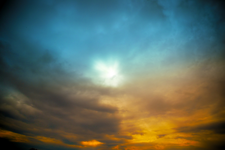 sun with rays at colored cloudscape dramatic viewの写真素材