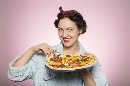 happy woman presents pizza on white backgroundの写真素材