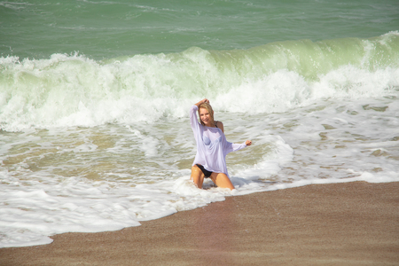 fun happy girl bath in sea foam laughingの写真素材
