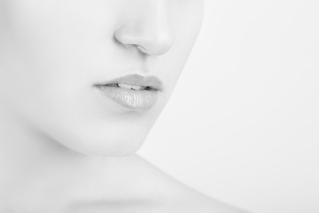 part of female face with professional beauty makeup on white background, monochromeの写真素材