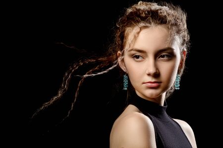 pretty young girl with flying curly hair closeup portrait