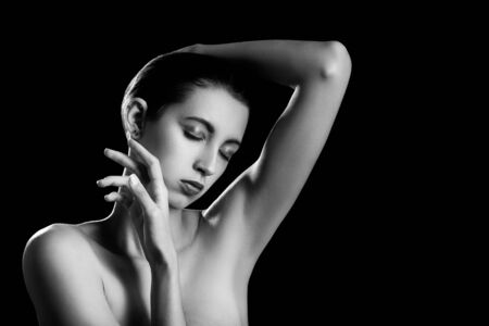 sensual girl on black background with copy space, monochromeの写真素材