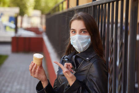 sensual woman in lingerie under sun light, looking at cameraの写真素材