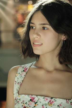 beautiful attractive young woman with natural makeup looking away closeup portraitの写真素材