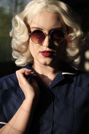 serious young blond woman retro style portrait