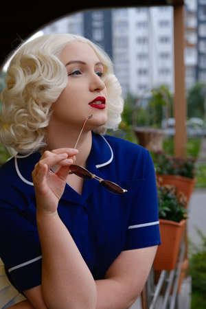 sad young blond woman retro style portrait