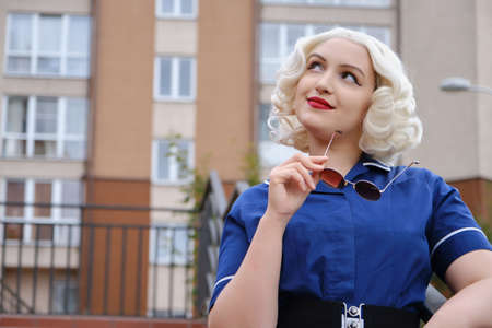 smiling young blond woman retro style portrait, monochrome