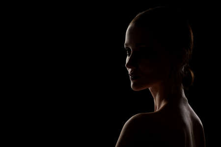 beautiful woman profile silhouette on black background with copy spaceの写真素材