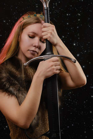 Portrait of viking woman in a traditional nordic clothes on stars background