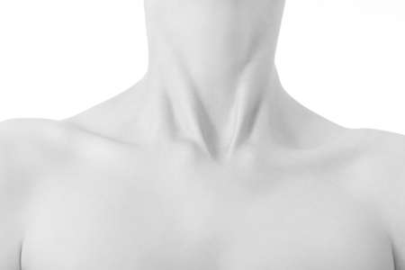 beautiful female slim neck with clavicle on black background, monochromeの写真素材