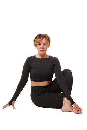 Mature woman doing yoga. Portrait calm mature woman relaxing meditation. Business woman breathing...